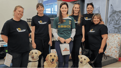 The SA Guide Dogs Associations Team, trainers and dogs in training.